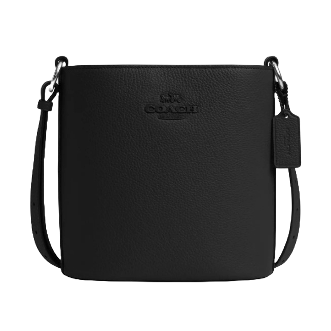 A black Coach bucket bag made of textured leather, featuring a shoulder strap and the Coach logo embossed on the front.