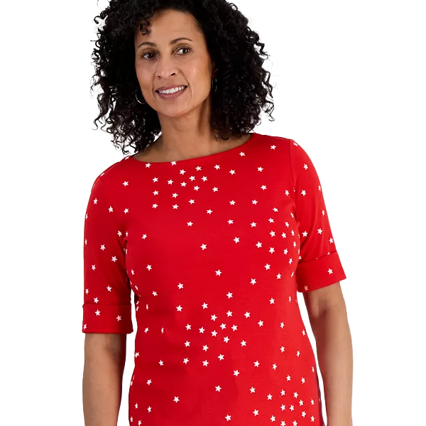 Style & Co. Star-Printed Top features a bright red color with scattered white star patterns, elbow-length sleeves, and a round neckline, offering a casual yet festive look.