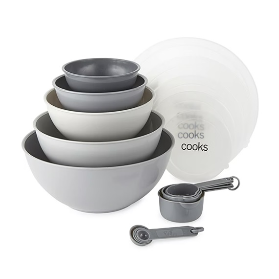 A set of stackable mixing bowls and measuring cups in varying shades of gray.