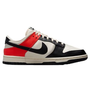 Nike Dunk Low shoes feature a white base with black overlays, a bold red heel accent, and a black Swoosh logo. The design is low-cut with a classic lace-up closure and a rubber outsole for traction.