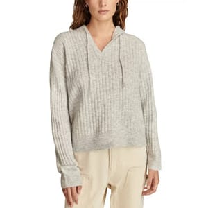 Light gray, ribbed hooded sweater with a V-neck and drawstrings, paired with cream-colored pants.
