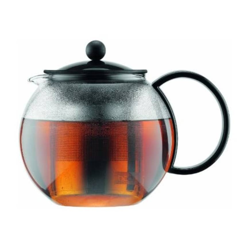 A glass teapot with a black plastic handle and lid, featuring an internal mesh infuser filled with tea. The design allows for easy pouring and infusion of loose leaf tea.
