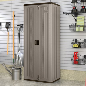 A tall, narrow beige storage cabinet stands in a garage beside various gardening tools and wall-mounted storage baskets.