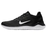 Nike Free Run 2018 shoes feature a black mesh upper with a prominent white Swoosh logo, offering flexibility and lightweight comfort. They have a rounded lace system and a white cushioned sole for enhanced natural movement.