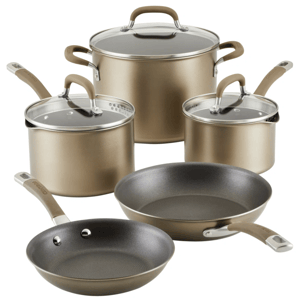 Nonstick cookware set with two frying pans, two covered saucepans, and one covered stockpot in gold-tone finish, featuring glass lids and ergonomic handles.