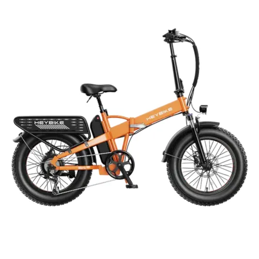 An orange electric bike with a foldable frame, fat tires, rear rack, and visible battery pack. It features a headlight and fenders designed for various terrains and practical use.