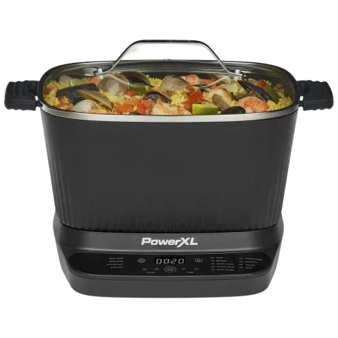 A PowerXL multi-cooker with a digital control panel, featuring a clear lid and handles, filled with a seafood and rice dish.