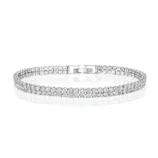 A sparkling silver bracelet adorned with two rows of diamond-like stones, featuring a clasp closure.
