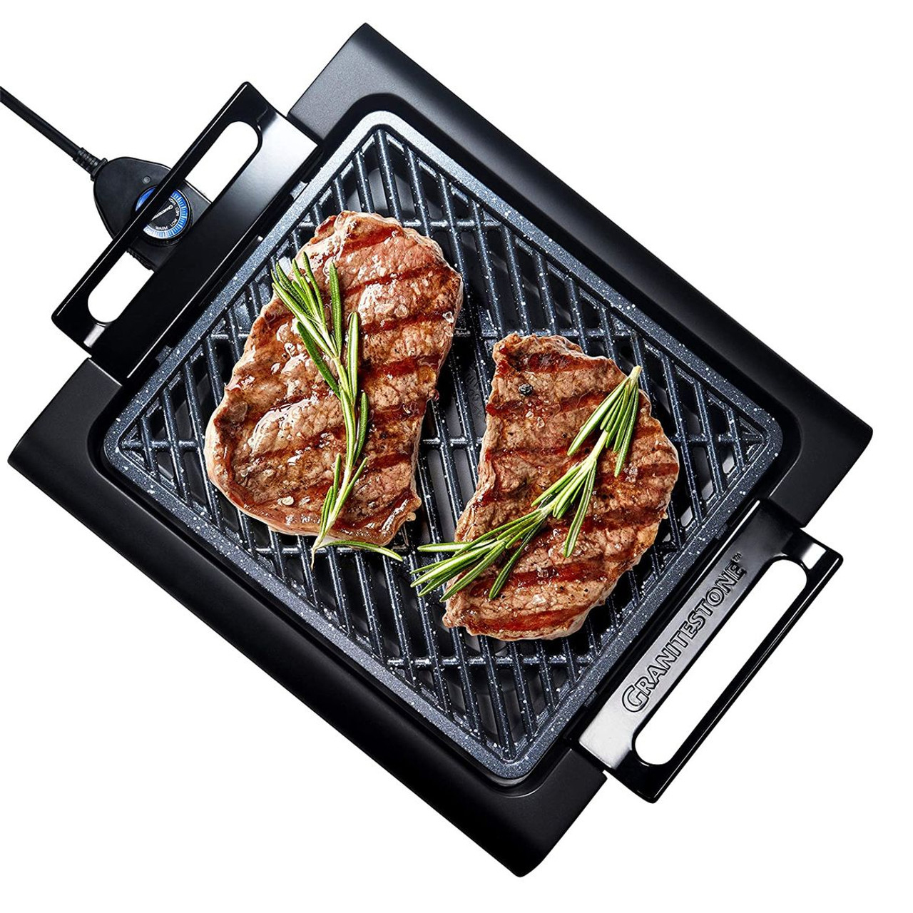 Electric grill with two steaks garnished with rosemary, featuring a non-stick cooking surface and adjustable temperature control.