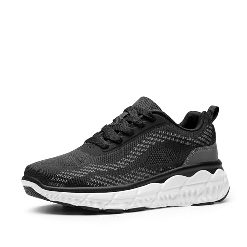 A pair of black women's sneakers with a white, wavy sole and a breathable mesh upper design.