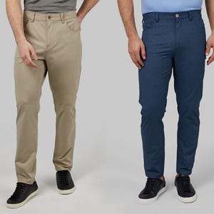 Two men modeling khaki and navy slim-fit chinos with black sneakers.