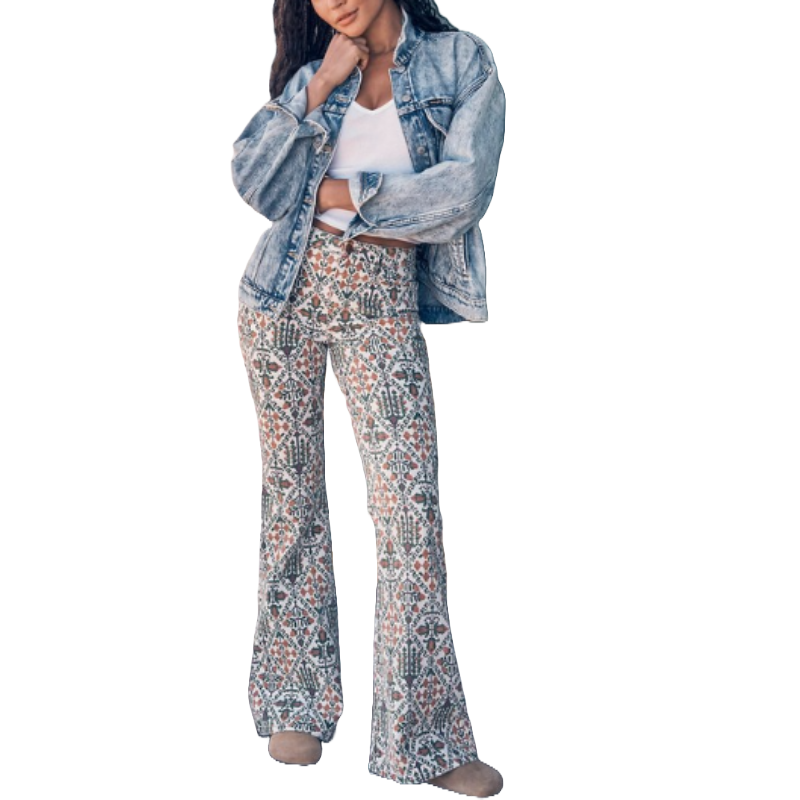 Wrangler Flare Laser Print Jeans feature an intricate geometric pattern with earthy tones, paired with a light wash denim jacket and a white tee for a casual, bohemian look.