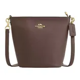 Brown Coach bucket bag with gold hardware and detachable strap, featuring the Coach logo on the front and a leather tag.