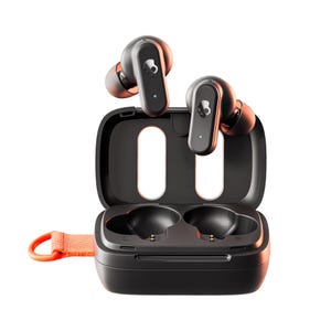 Skullcandy Dime 3 Earbuds feature a compact design with a charging case, showcasing a sleek black finish with orange accents and distinctive branding. The earbuds are positioned above the case, which has a loop for easy carrying.
