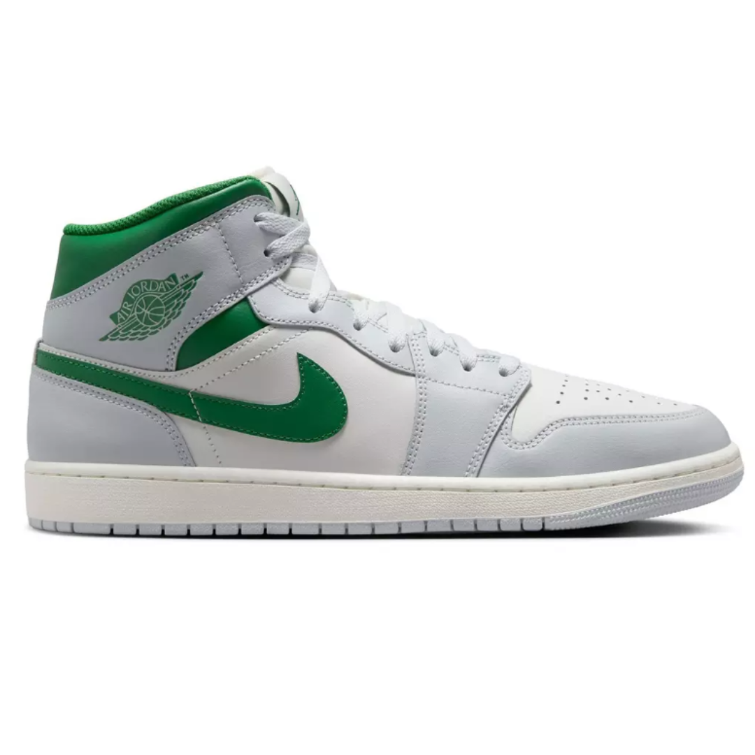 A white and green Air Jordan shoe with a green Nike swoosh and Air Jordan logo on the ankle.