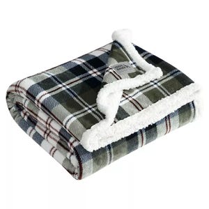Eddie Bauer Faux-Shearling Throw features a green, white, and brown plaid pattern with a soft, fluffy white faux-shearling lining.