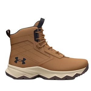 A brown, high-top Under Armour boot with a rugged sole and lace-up front, featuring the brand's logo on the side.