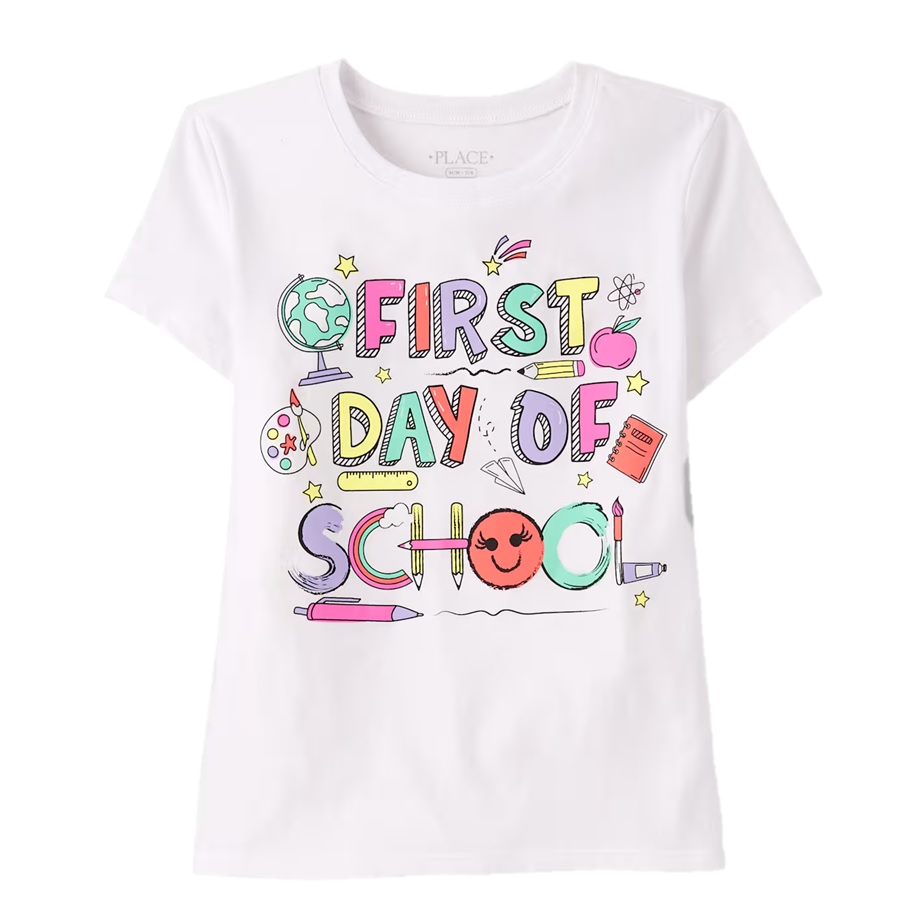A white children's t-shirt with colorful illustrations and the text \“First Day of School,\“ featuring school-related icons like a globe, apple, book, and pencil.