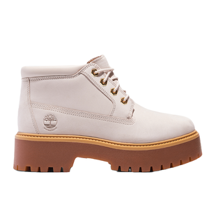 Light-colored ankle boot with chunky brown sole, waterproof material, lace-up front, and a branded logo on the side.