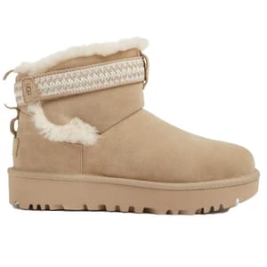 Tan suede ankle boot with white fur lining, textured knit ankle strap, and a durable, grooved sole.