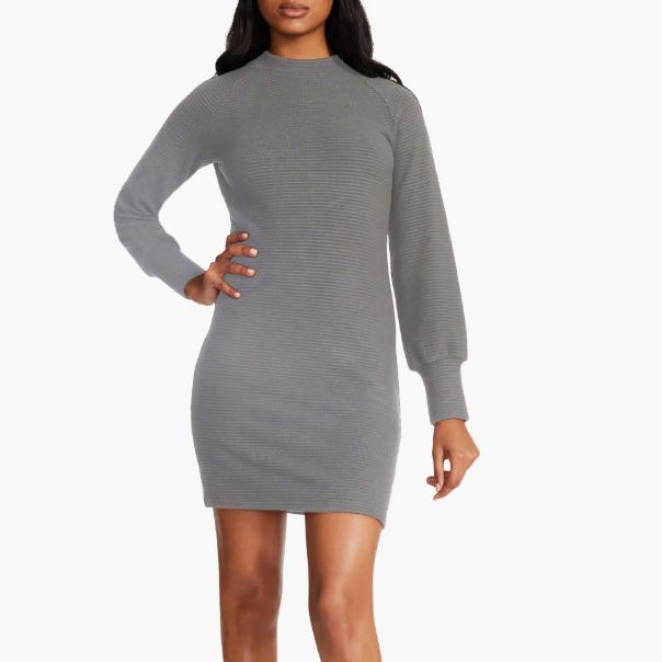 A fitted grey dress with a ribbed design, long sleeves, and a modest high neckline.