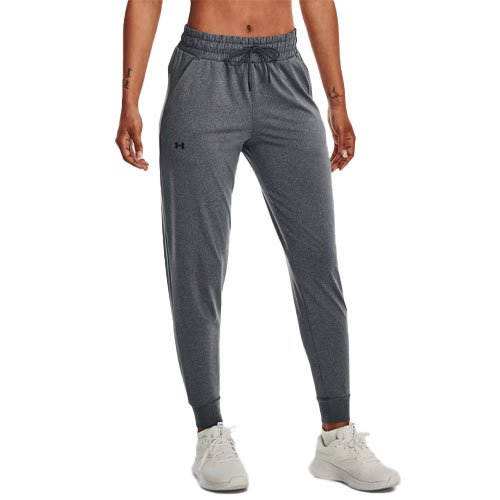 Gray joggers with an elastic waistband and ankle cuffs, featuring a drawstring and small logo on the left thigh. Paired with white athletic shoes.