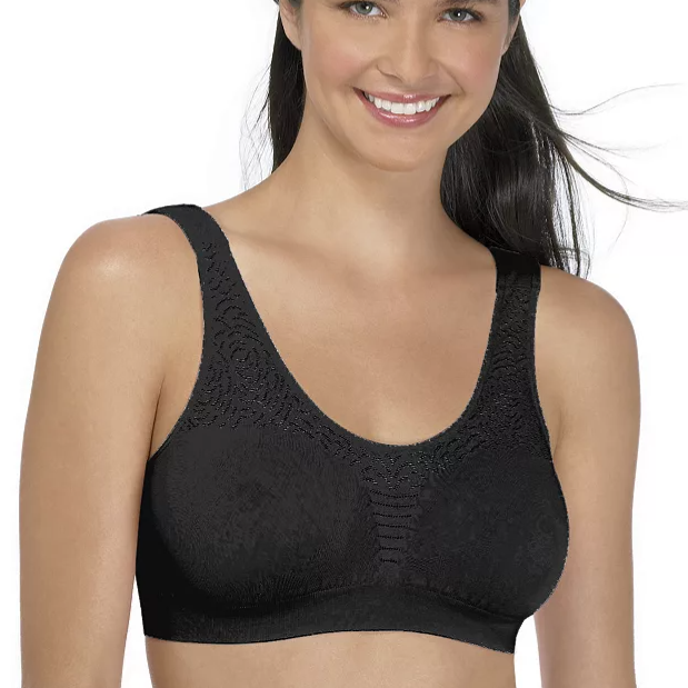 A woman is wearing a black, seamless bra with a patterned design on the fabric.