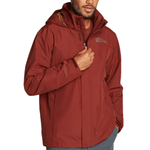 The Eddie Bauer Rainfoil Jacket is a maroon waterproof jacket with a hood, featuring a full front zipper and two side pockets. It's designed for outdoor use and provides protection against rain.