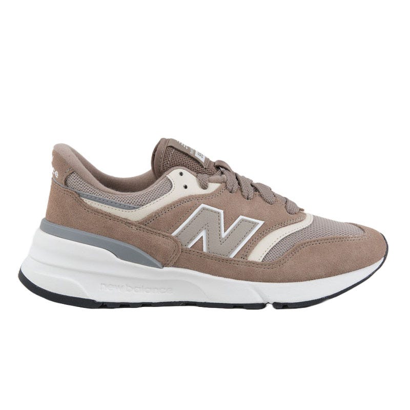 New Balance sneaker in brown and beige with white accents, featuring a suede and mesh upper, the signature \“N\“ logo, and a cushioned white sole.