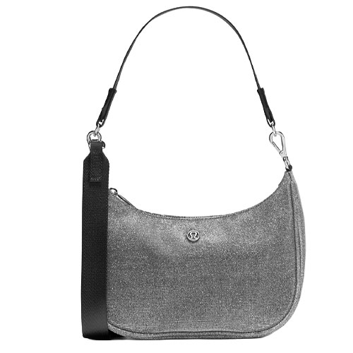 A silver textured shoulder bag with a detachable black strap, featuring a small centered logo.