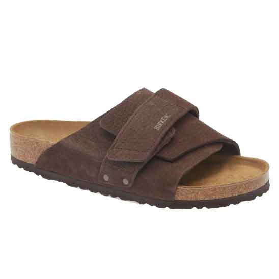 Brown sandal with adjustable straps, cork footbed, and textured sole for comfort.