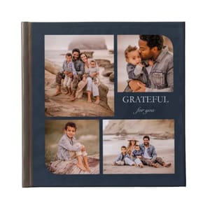 A Shutterfly custom photo book featuring a dark cover with four family photos arranged on it, accompanied by the text \“GRATEFUL for you.\“