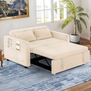 A beige 55\“ reclining sleeper sofa featuring a pull-out bed, armrest storage pockets, and cushioned back, set on a blue-patterned rug in a room with a potted plant and wall art.