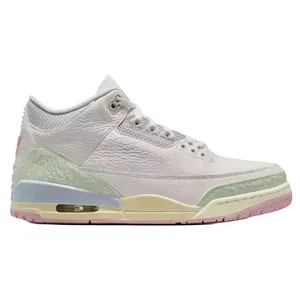 A light-colored sneaker with pastel accents, featuring a textured upper and visible air unit in the sole, resembling a classic basketball shoe design.