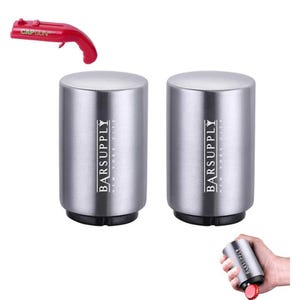 Two silver bottle openers from \“BarSupply\“ alongside a red novelty cap gun bottle opener, with an inset showing one opener in hand use.