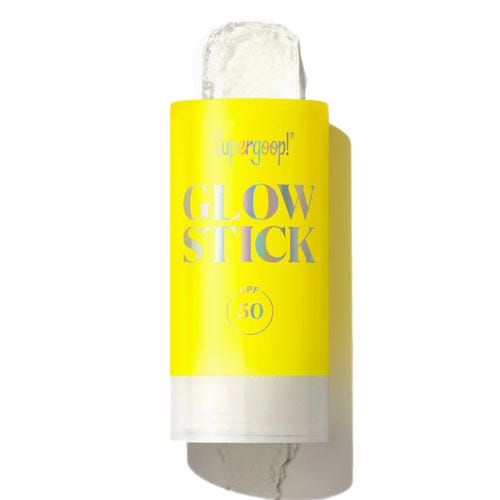Supergoop! Glow Stick SPF 50, a sunscreen stick with a yellow label, designed for easy application.