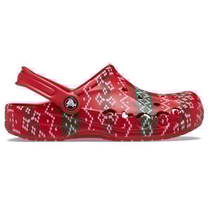 Red Crocs with a festive holiday pattern featuring green and white designs, showcasing the classic clog style with ventilation ports and an adjustable heel strap.