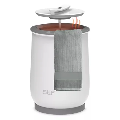 A white towel warmer with a gray towel hanging from it, featuring a lid that lifts to release heat.