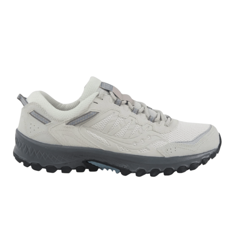 A light gray and white trail running shoe featuring a rugged black sole, mesh upper for breathability, and reinforced areas for durability.