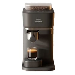 Philips Barista espresso machine with a sleek black design features a built-in coffee bean grinder and a spout for brewing espresso directly into a cup.