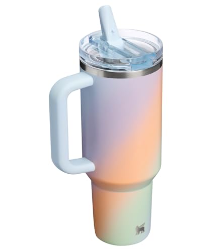 A gradient-colored insulated tumbler with a handle, featuring a lid and straw.