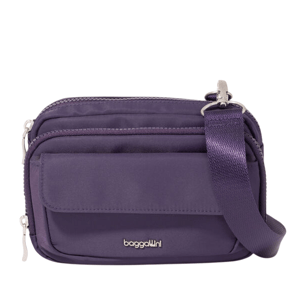 Purple crossbody bag with an adjustable strap, featuring multiple zippered compartments and a flap pocket, branded with \“baggallini.\“