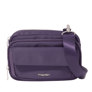 Purple crossbody bag with an adjustable strap, featuring multiple zippered compartments and a flap pocket, branded with \“baggallini.\“