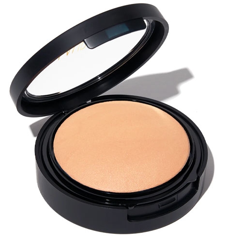 Laura Geller Full Coverage Foundation is in a compact with a black lid, featuring a pressed powder with a smooth, matte finish suitable for creating an even skin tone.