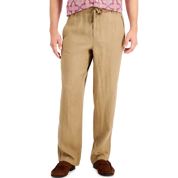 A pair of beige drawstring linen pants is shown, paired with brown loafers.