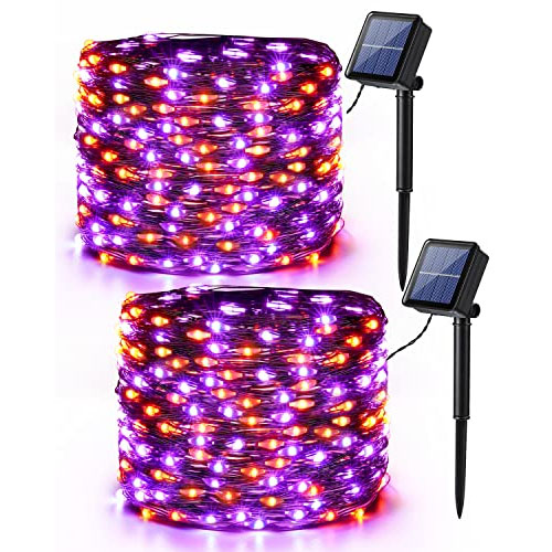 Solar-powered string lights with purple and orange LEDs, featuring two solar panels with stakes for outdoor decoration.
