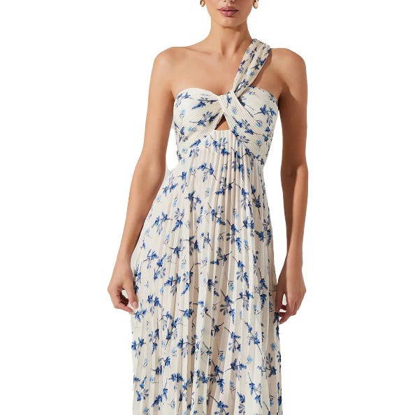 A white, one-shoulder floral dress featuring a blue pattern with a twisted knot design across the chest and a cut-out detail beneath.