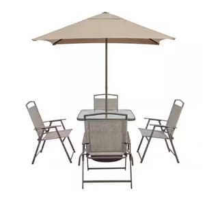 6-piece patio set includes a square table with a glass top, four folding chairs with armrests, and a beige umbrella providing shade. The design is simple and functional, suitable for outdoor settings.