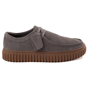 Gray suede lace-up shoe with a textured brown rubber sole and stitched detailing.