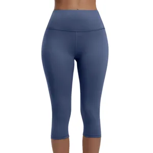 High-waisted, blue, three-quarter length leggings designed for comfort and mobility, featuring a smooth, seamless finish suitable for workouts or casual wear.